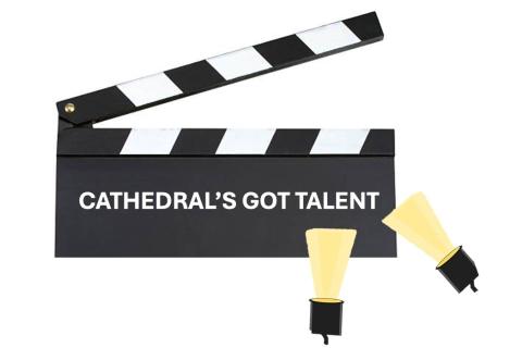 "Cathedral's Got Talent" written on a clapboard with two spotlights pointing up 
