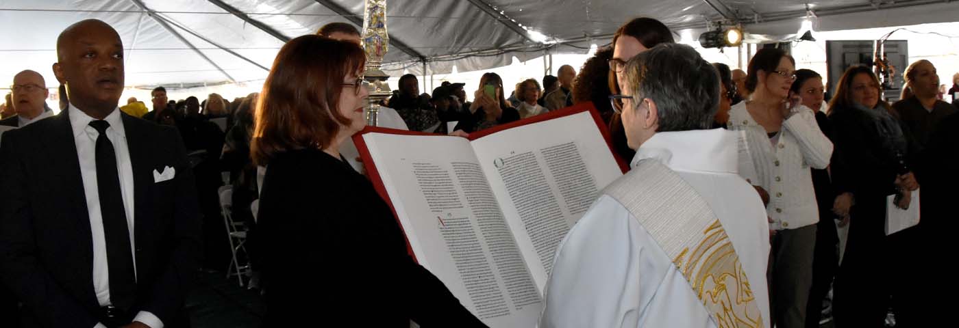 A deacon reading the Gospel
