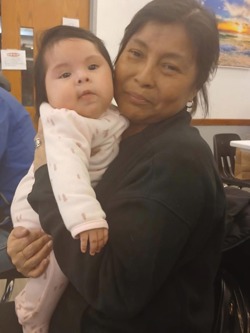 Ketty Garcia (pictured above with her granddaughter), an active member of St. Bart’s in White Plains, who was swept up in the same extralegal arrests that Soo was.