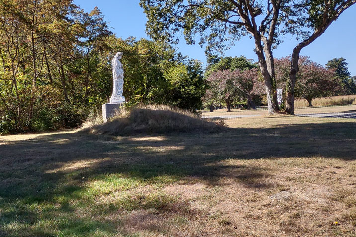 A statue of the Blessed Virgin Mary overlooks the grounds