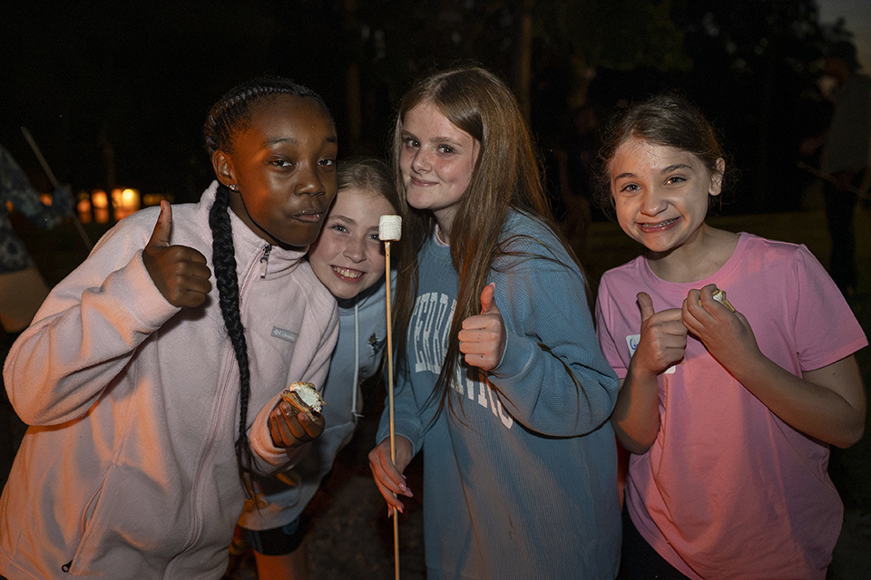 Elevate Campers having Marshmellows