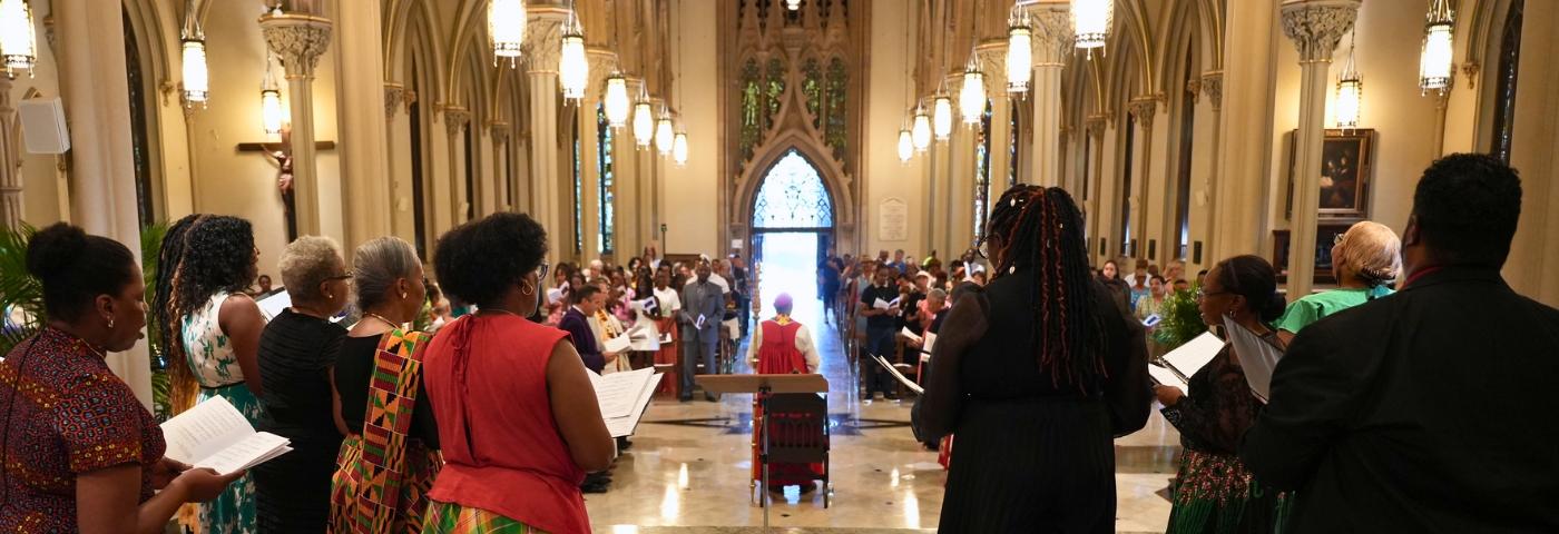 The Choir for Juneteenth sings towards the congregation in the Cathedral of the Incarnation