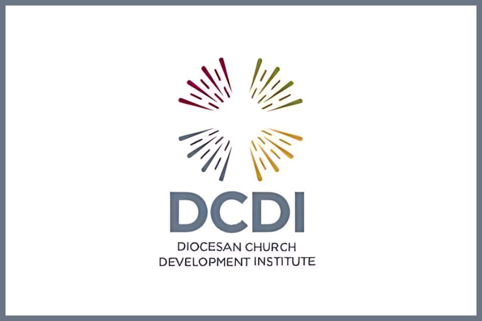 A picture of a cross made out of colored light rays. Text "DCDI" below.