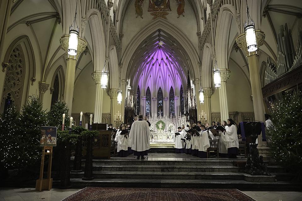 Picture of the Cathedral of the Incarnation's nave with the Choir singing Choral Evensong