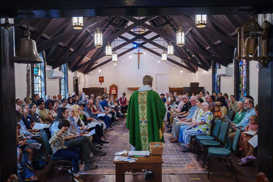 Fr. Carl Adair speaks to the full Episcopal Mission in Sunnyside