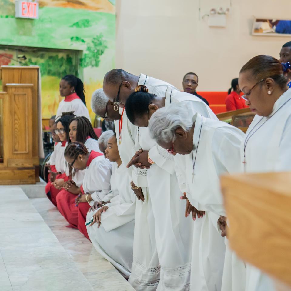 Acolytes kneeling