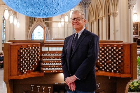 Canon Larry Tresmky, stands in front of the Cathedral Organ Console