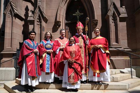 Ordinands stand with Bishop Provenzano outside the Cathedral of the Incarnation